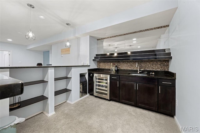 351 Oak Stand Ct, Chesterfield, MO 63005 - bar area with wine cooler, a sink, decorative backsplash, baseboards, and hanging light fixtures