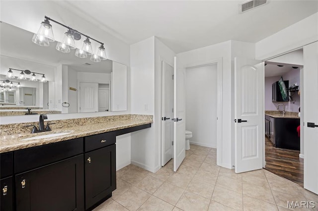 351 Oak Stand Ct, Chesterfield, MO 63005 - bathroom featuring toilet, baseboards, vanity, and tile patterned flooring