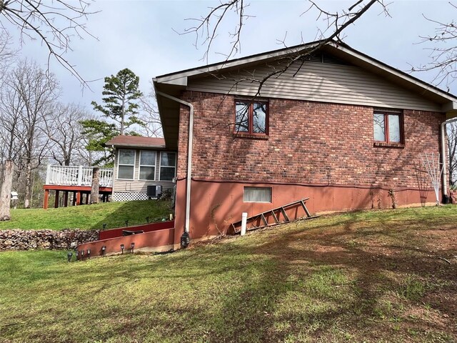 515 Rue Lamande, Bonne Terre, MO 63628 - rear view of property with brick siding, a lawn, and a wooden deck