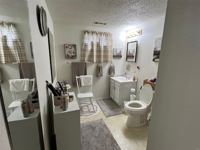 515 Rue Lamande, Bonne Terre, MO 63628 - bathroom featuring toilet, vanity, and a textured ceiling