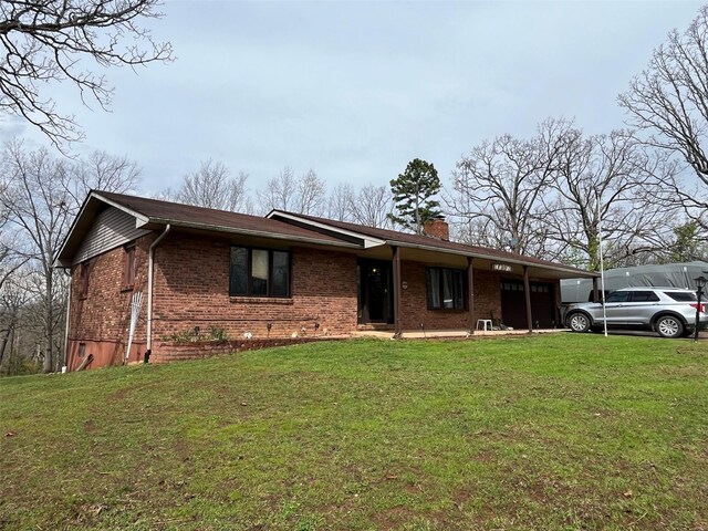 515 Rue Lamande, Bonne Terre, MO 63628 - ranch-style home featuring brick siding, a chimney, and a front lawn