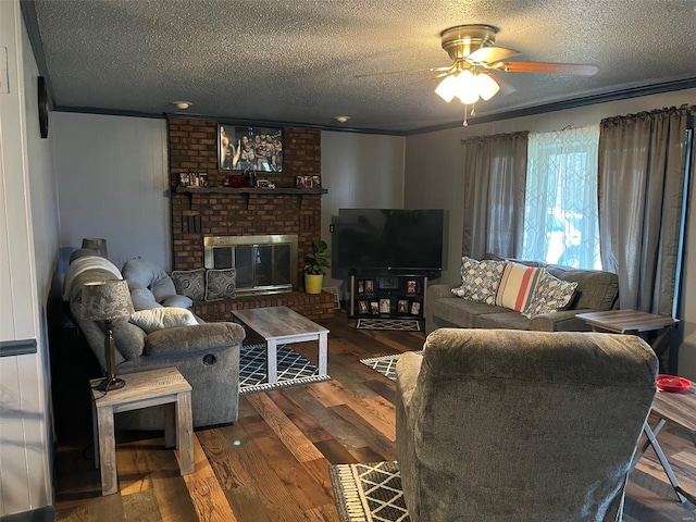 515 Rue Lamande, Bonne Terre, MO 63628 - living room featuring a textured ceiling, ceiling fan, wood finished floors, and a fireplace