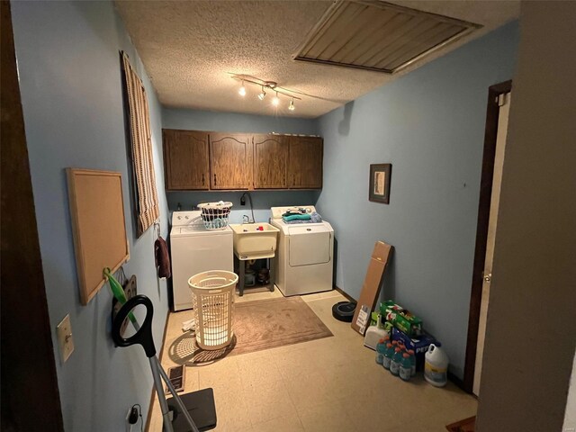 515 Rue Lamande, Bonne Terre, MO 63628 - washroom with separate washer and dryer, cabinet space, light flooring, and a textured ceiling