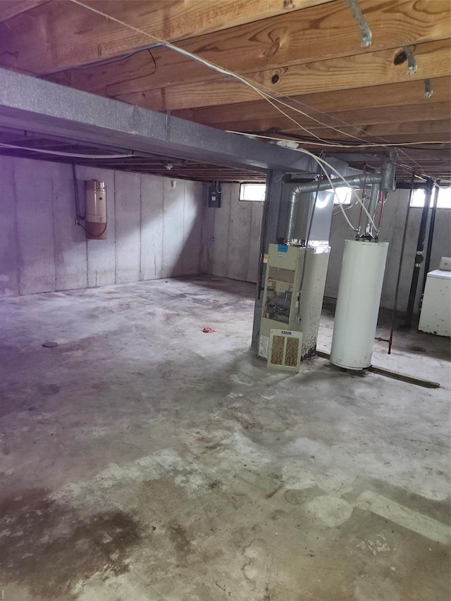 6081 Silver Fox Dr, Florissant, MO 63034 - basement featuring water heater, washer / dryer, heating unit, and plenty of natural light