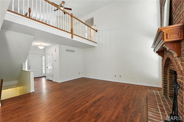 1827 Pheasant Run Dr, Maryland Heights, MO 63043 - unfurnished living room featuring a high ceiling, a ceiling fan, and wood finished floors