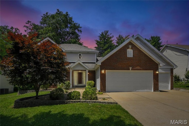 1827 Pheasant Run Dr, Maryland Heights, MO 63043 - traditional-style home featuring a garage, driveway, brick siding, and a lawn
