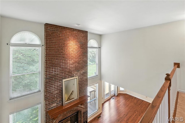 1827 Pheasant Run Dr, Maryland Heights, MO 63043 - unfurnished living room featuring wood finished floors and baseboards