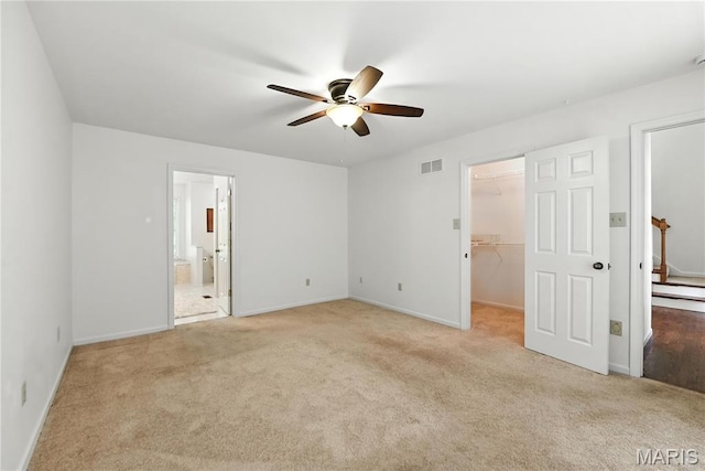 1827 Pheasant Run Dr, Maryland Heights, MO 63043 - unfurnished bedroom with carpet flooring, a spacious closet, ensuite bath, and a ceiling fan