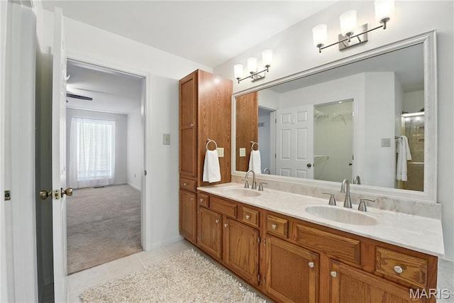 1827 Pheasant Run Dr, Maryland Heights, MO 63043 - bathroom featuring double vanity, tile patterned flooring, and a spacious closet