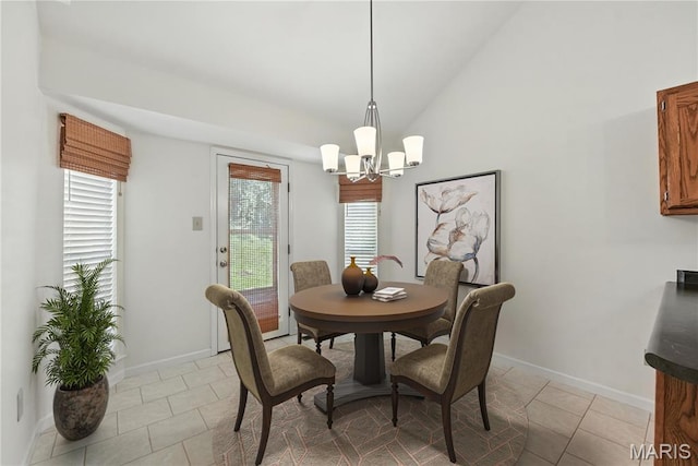 1827 Pheasant Run Dr, Maryland Heights, MO 63043 - dining area with a chandelier, lofted ceiling, and light tile patterned flooring