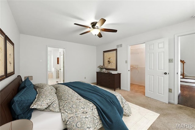 1827 Pheasant Run Dr, Maryland Heights, MO 63043 - bedroom with a spacious closet, light carpet, a ceiling fan, and ensuite bathroom
