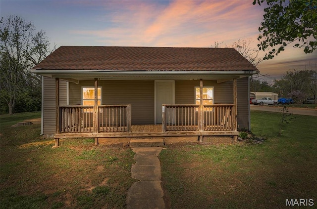 209 N Washington St, Desloge, MO 63601 - back of property featuring covered porch and a lawn