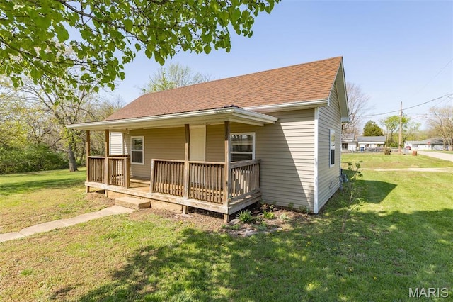 209 N Washington St, Desloge, MO 63601 - bungalow-style home with a front lawn and roof with shingles