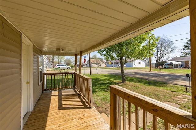 209 N Washington St, Desloge, MO 63601 - deck with a porch, a residential view, and a lawn