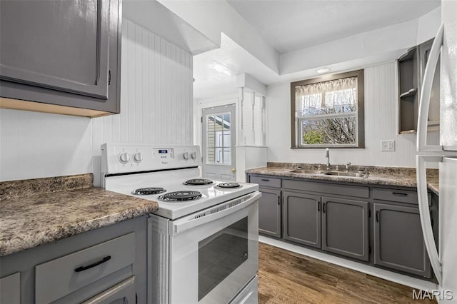 209 N Washington St, Desloge, MO 63601 - kitchen featuring white electric range, gray cabinetry, a sink, and dark wood-style floors
