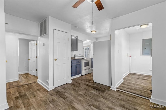 209 N Washington St, Desloge, MO 63601 - kitchen featuring white appliances, electric panel, a ceiling fan, dark wood finished floors, and blue cabinets