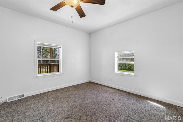 209 N Washington St, Desloge, MO 63601 - carpeted empty room with plenty of natural light, ceiling fan, and baseboards