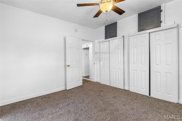 209 N Washington St, Desloge, MO 63601 - unfurnished bedroom featuring dark colored carpet, multiple closets, baseboards, and a ceiling fan