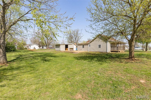 209 N Washington St, Desloge, MO 63601 - view of green lawn with a wooden deck