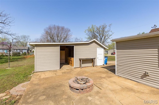 209 N Washington St, Desloge, MO 63601 - view of patio featuring an outbuilding and an outdoor fire pit