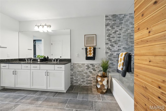 713 Alban Aly, Ofallon, MO 63368 - full bath featuring double vanity, a tub to relax in, and tile patterned flooring