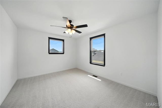 713 Alban Aly, Ofallon, MO 63368 - carpeted spare room featuring healthy amount of natural light, baseboards, and ceiling fan