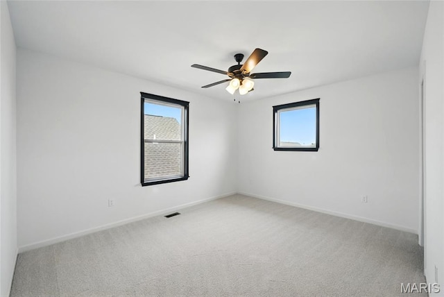 713 Alban Aly, Ofallon, MO 63368 - carpeted spare room with healthy amount of natural light, baseboards, and a ceiling fan