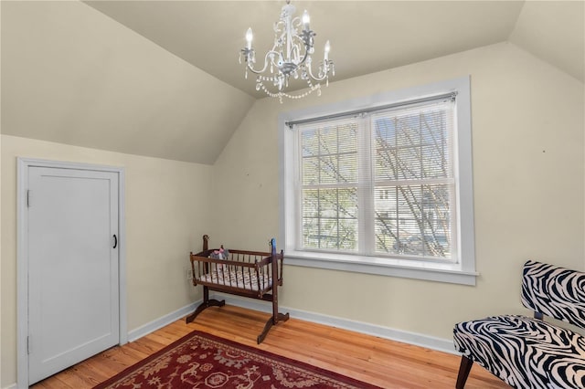 669 Park Ave, Sikeston, MO 63801 - bonus room featuring vaulted ceiling, light wood finished floors, a chandelier, and baseboards