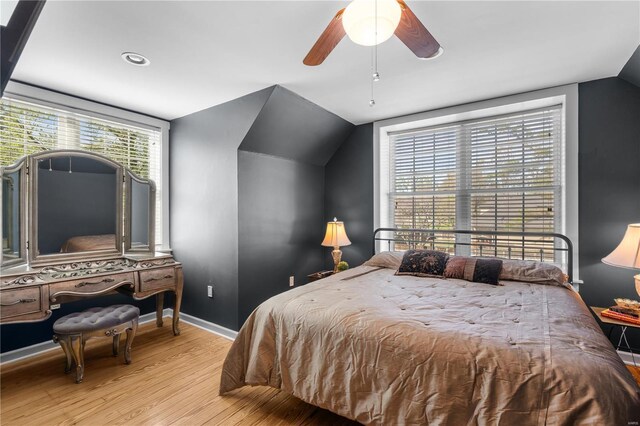 669 Park Ave, Sikeston, MO 63801 - bedroom featuring wood finished floors, lofted ceiling, baseboards, and ceiling fan
