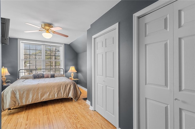 669 Park Ave, Sikeston, MO 63801 - bedroom featuring light wood finished floors, vaulted ceiling, a ceiling fan, baseboards, and a closet