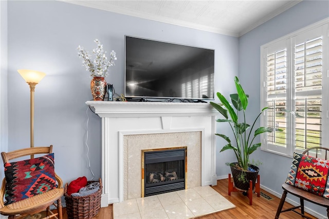 669 Park Ave, Sikeston, MO 63801 - detailed view of wood finished floors, a fireplace, and crown molding