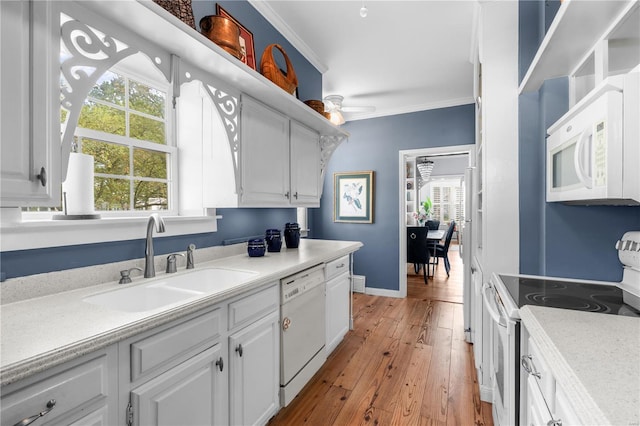 669 Park Ave, Sikeston, MO 63801 - kitchen featuring white appliances, a sink, a ceiling fan, plenty of natural light, and crown molding