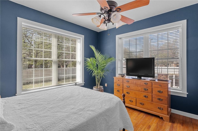 669 Park Ave, Sikeston, MO 63801 - bedroom featuring wood finished floors, baseboards, and ceiling fan