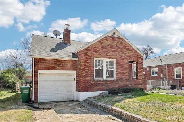 8724 Magdalen Ave, Saint Louis, MO 63144 - view of front facade featuring brick siding, a chimney, driveway, and a front yard