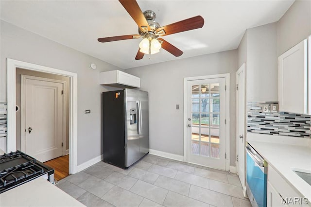 8724 Magdalen Ave, Saint Louis, MO 63144 - kitchen with stainless steel fridge with ice dispenser, light countertops, white cabinets, and a ceiling fan