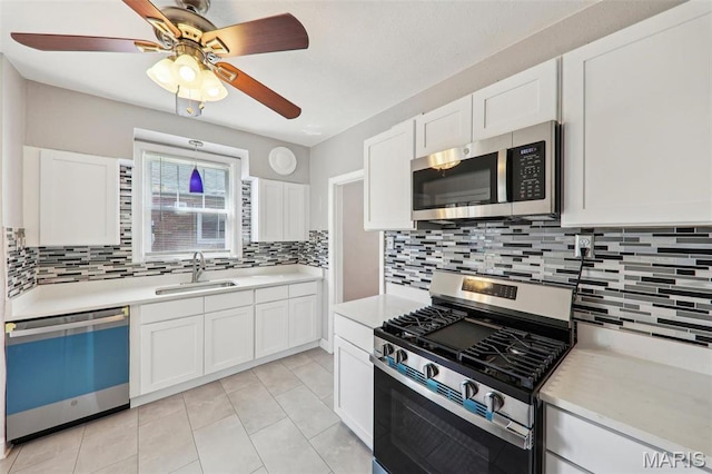 8724 Magdalen Ave, Saint Louis, MO 63144 - kitchen featuring stainless steel appliances, a sink, light countertops, and tasteful backsplash