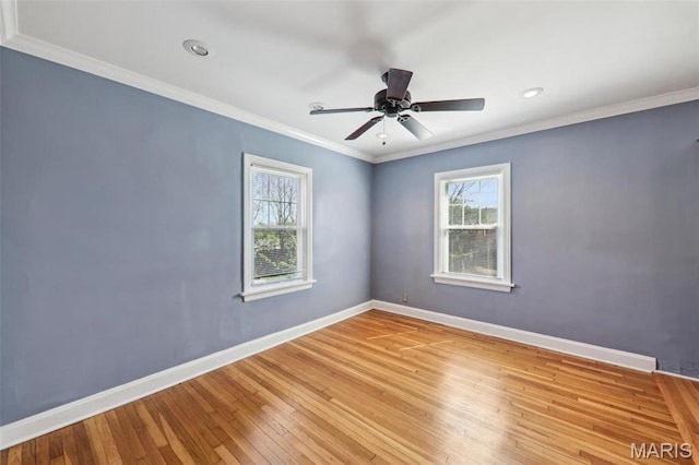 8724 Magdalen Ave, Saint Louis, MO 63144 - empty room with plenty of natural light, baseboards, light wood-style flooring, a ceiling fan, and ornamental molding