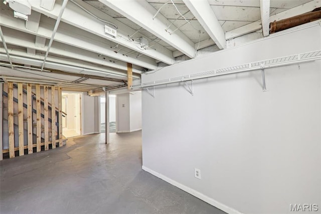 8724 Magdalen Ave, Saint Louis, MO 63144 - basement with baseboards and stairs