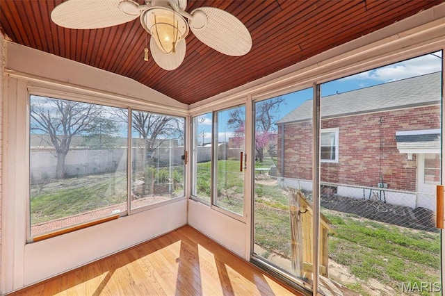 8724 Magdalen Ave, Saint Louis, MO 63144 - unfurnished sunroom featuring vaulted ceiling, plenty of natural light, and a ceiling fan