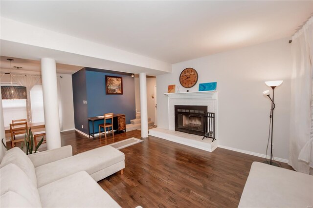 5507 Waterman Blvd Unit C, Saint Louis, MO 63112 - living area featuring baseboards, dark wood-type flooring, and a fireplace
