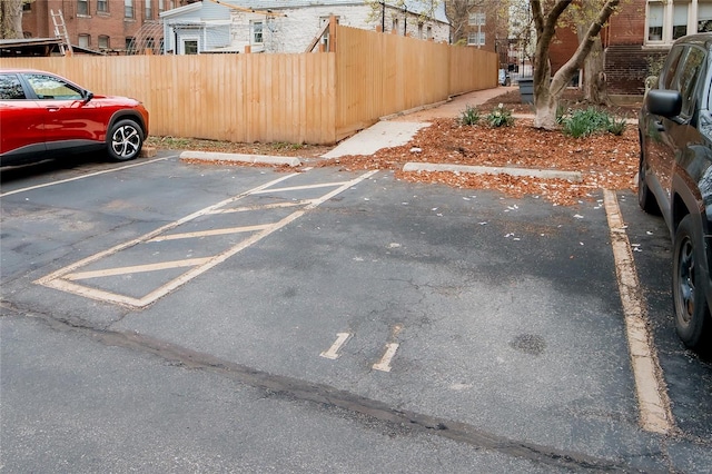 5507 Waterman Blvd Unit C, Saint Louis, MO 63112 - uncovered parking lot featuring fence