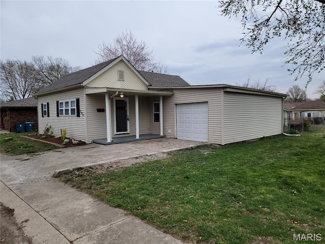 304 S Hickory St, Troy, IL 62294 - view of front of property featuring covered porch, driveway, a garage, a front lawn, and roof with shingles