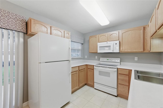 430 Benton Dr Unit C, Saint Peters, MO 63376 - kitchen featuring white appliances, light brown cabinets, a sink, and light countertops