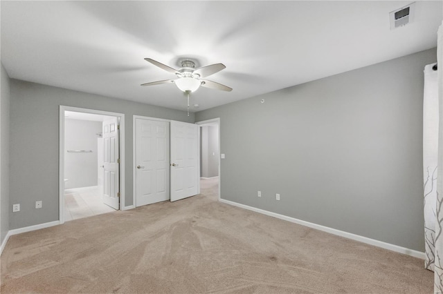 430 Benton Dr Unit C, Saint Peters, MO 63376 - unfurnished bedroom featuring carpet floors, baseboards, connected bathroom, and ceiling fan