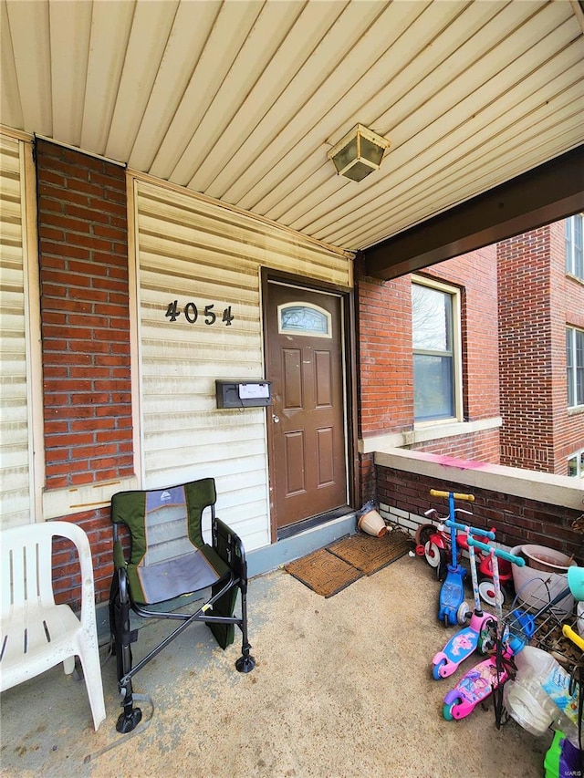 4052 Detonty St, Saint Louis, MO 63110 - view of exterior entry with brick siding and covered porch