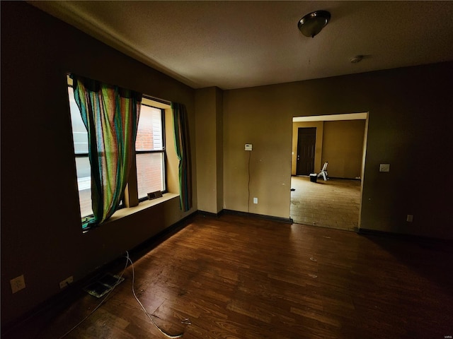 4052 Detonty St, Saint Louis, MO 63110 - unfurnished room featuring wood finished floors and baseboards