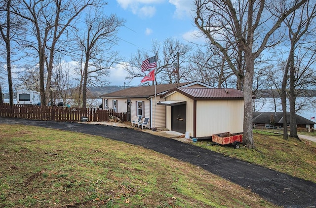 15 Allen Cir, Sunrise Beach, MO 65079 - back of property featuring an outbuilding