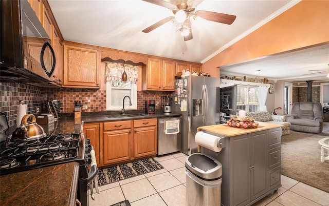 15 Allen Cir, Sunrise Beach, MO 65079 - kitchen with black appliances, a sink, a ceiling fan, light tile patterned flooring, and decorative backsplash