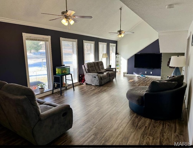 living area featuring a ceiling fan, a textured ceiling, wood finished floors, vaulted ceiling, and ornamental molding