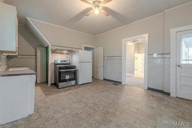 338 Horn Ave, Saint Louis, MO 63125 - kitchen with gas range, ceiling fan, freestanding refrigerator, light floors, and a sink